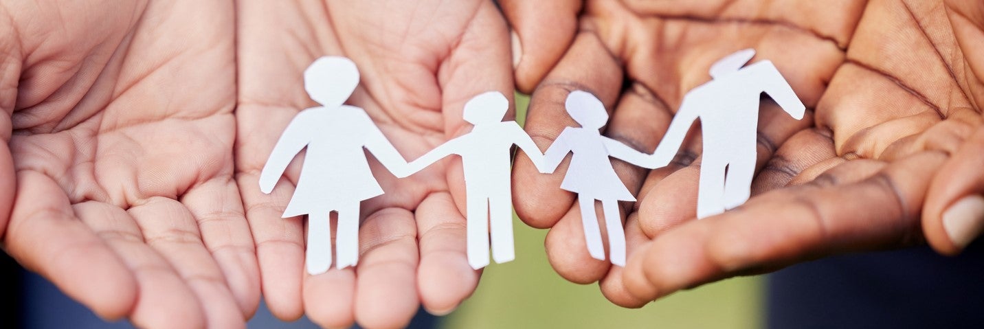 Image of family holding paper cutout 2